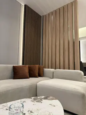 a living room with a couch and a table at Damac Amman Modern Luxury Apartment in Amman