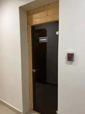 a door with a sign that says slow on it at Damac Amman Modern Luxury Apartment in Amman