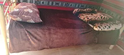 a bed with two pillows on top of it at Nature rum camp in Wadi Rum