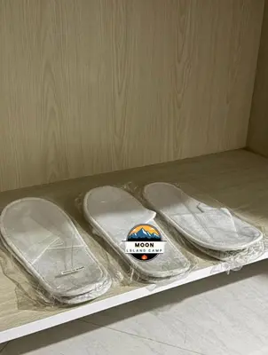 a pair of flip flops sitting on a shelf at MOON ISLAND lUXURY CAMP in Wadi Rum