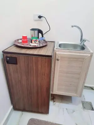 a small kitchen with a sink and a counter at I cloud Petra hostel in Wadi Musa