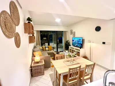 a living room with a table and a couch at Ayla in Aqaba