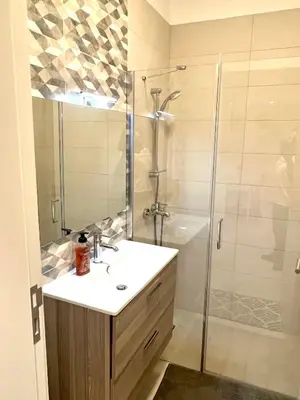 a bathroom with a sink and a shower at Ayla in Aqaba
