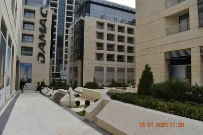 a building with a walkway in front of a building at Luxury one bedroom apartment at Damac towers in Amman