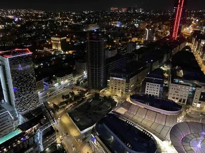 an aerial view of a city at night at Luxury one bedroom apartment at Damac towers in Amman