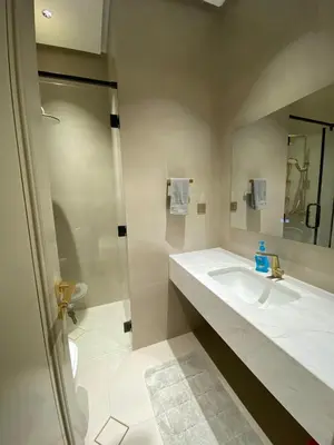 a bathroom with a sink and a mirror at Luxury apartment for rent in BoulevardAirport Road in Amman