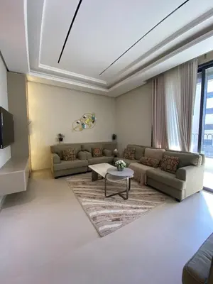 a living room with couches and a table at Luxury apartment for rent in BoulevardAirport Road in Amman