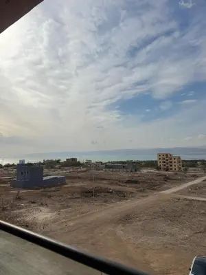 a view of a construction site with the ocean at Seaview horizon apartment in Sowayma