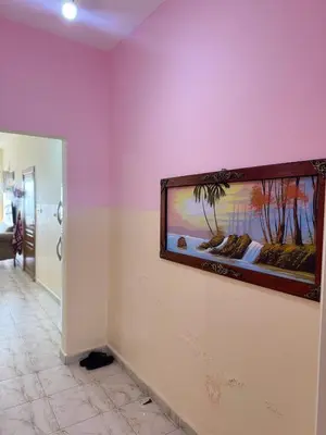 a large fish tank on a wall in a room at Seaview horizon apartment in Sowayma