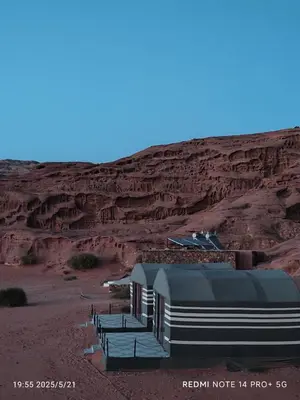 a building in the middle of the desert at Bubble's Home in Wadi Rum