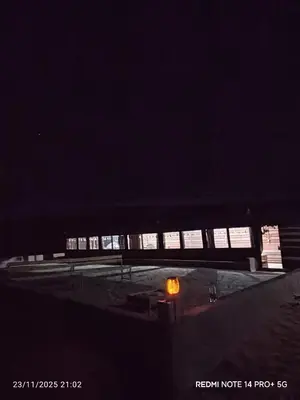 a row of lights in a building at night at Bubble's Home in Wadi Rum