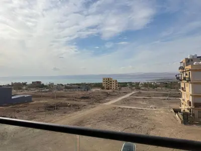 a view from a window of a construction site at panorama sea view apartment in Sowayma