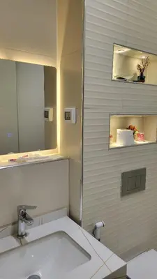 a bathroom with a sink and a mirror at Lavender Résidence in Amman