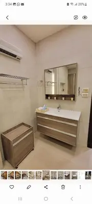 a bathroom with a sink and a mirror at Lavender Résidence 102 in Amman