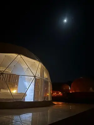 a dome tent with the moon in the background at Nile bedouin camp in Aqaba
