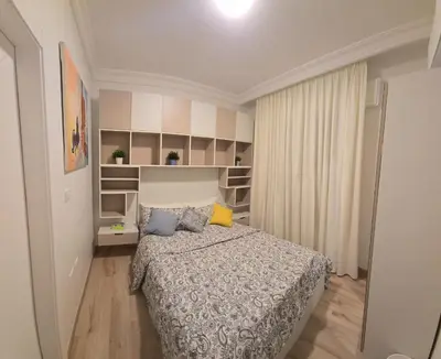 a bedroom with a bed in a room at Rainbow 7 in Amman