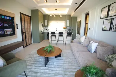 a living room with a couch and a table at The FWD Living - FWD2 in Amman
