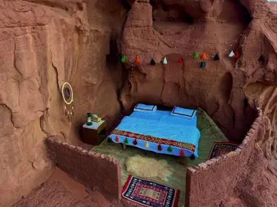 a model of a bed in a fake cave at Magic Cave Night Tours in Wadi Rum