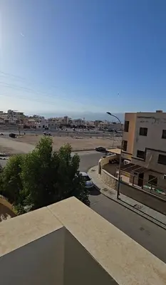 a view of a city with a street and buildings at عبدالرحمن الشطناوي in Aqaba