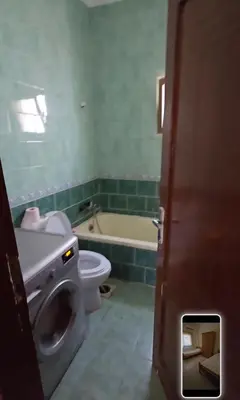 a bathroom with a toilet and a sink and a tub at عبدالرحمن الشطناوي2 in Aqaba