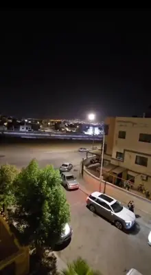 a car parked in a parking lot at night at عبدالرحمن الشطناوي2 in Aqaba