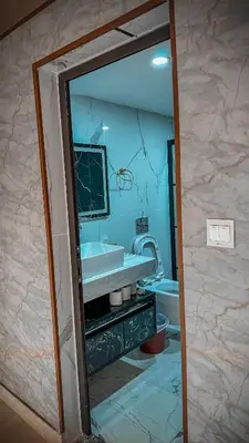 a mirror in a bathroom with a sink and a tub at TAJ luxury Camp in Wadi Rum