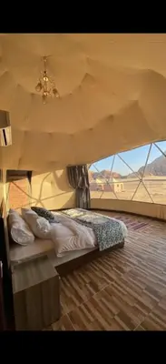 a bedroom with a bed in a tent at Essam camb in Disah