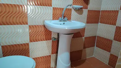 a bathroom with a sink and a toilet at Stone house in Amman