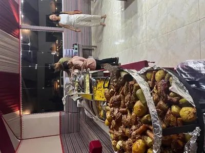 a buffet with meat and other food items on display at Wadi Rum Main Road Visitor Center in Disah
