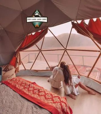 a couple of people laying in a tent at RUM ELARA lUXRY CAMP in Wadi Rum