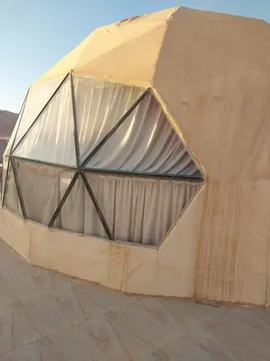 a large tent is set up on the ground at Essam in Wadi Rum