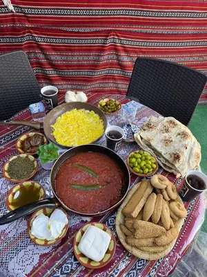 a table with some food on top of a table at غبار الطلح هاوس in Ma‘ān