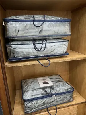 two pieces of luggage are sitting on a shelf at الكرك الثنية in Kerak