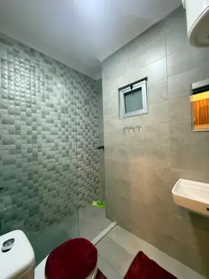 a bathroom with a shower and a toilet and a sink at Swefieh studio 8 in Amman