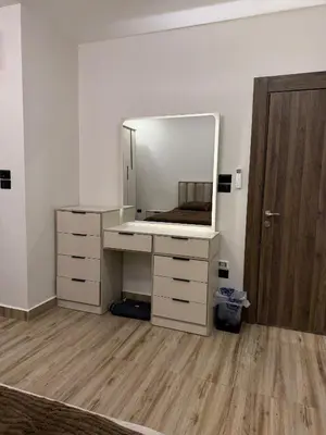 a dressing room with a mirror and a dresser at Luxury apartment شقة فخمة in Amman