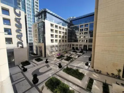 an aerial view of a courtyard in a building at Pasha Holiday - DAMAC Tower in Amman
