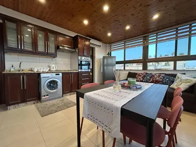 a kitchen and dining room with a table and chairs at 7th Circle 1 bedroom flat Amman, pleasant views in Amman