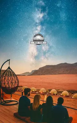 a group of people sitting in front of a movie poster at WADI RUM RESERVE BUBBlE CAMP in Wadi Rum