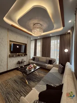a living room with a couch and a table at Mirabella Villa in Al Rama