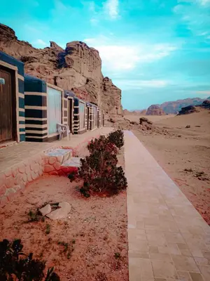 a building in the middle of the desert at Solar Soul Camp - Wadi Rum Desert Experience & Stargazing in Wadi Rum