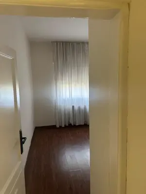 an empty room with a door leading to a radiator at Rasheed pearl in Amman