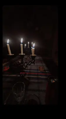 a group of candles on a table in a dark room at البترا Petra in Abū al Lasan