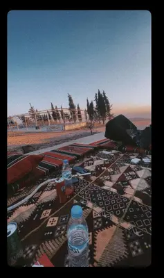 a group of water bottles sitting on top of a table at البترا Petra in Abū al Lasan
