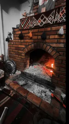 a brick oven with a fire inside of it at البترا Petra in Abū al Lasan