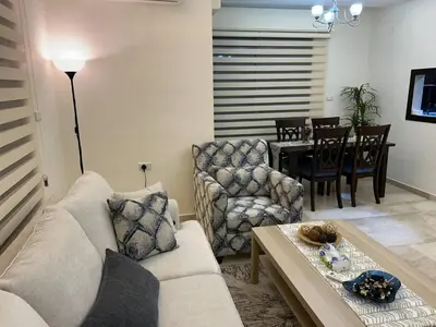 a living room with a couch and chairs and a table at 3 bedroom flat, 3 bathrooms, 7th circle, Amman in Amman