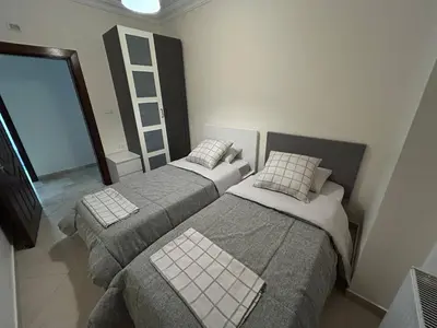 two beds in a small room with at 3 bedroom flat, 3 bathrooms, 7th circle, Amman in Amman