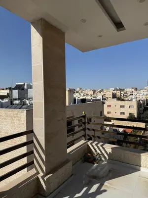 a view of a city from a building at 2bedrooms sport city in Amman