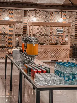 a table with a blender on top of it at Victoria rum Luxury camp in Disah