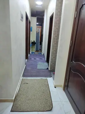 a corridor with carpeted floors and a hallway with doors at شقق مفروشه فاخره2 in Aqaba