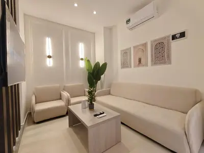 a living room with a couch and a table at ذا سهل ستيز in Amman